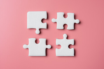 Four pieces of a puzzle,solving problems in business,Innovation and teamwork in company.