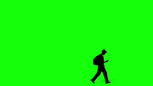 Walking silhouette boy cartoon animation. Loop animation ( 4K video ). green background for background transparent use.
