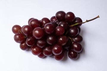 Bunch of red globe grapes isolated on white background