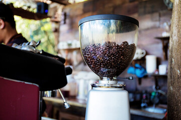 Coffee roaster in coffee shop.