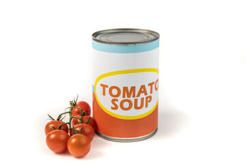 A generic labeled can of tomato soup with a bunch of ripe red tomatoes on the vine isolated on white