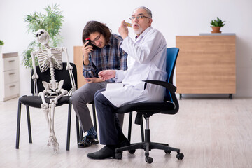 Young male patient visiting experienced doctor psychiatrist
