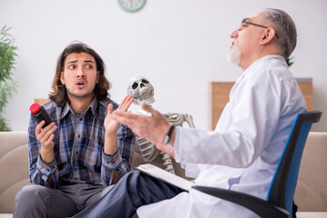 Young male patient visiting experienced doctor psychiatrist