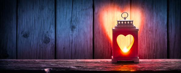

Lantern With Heart Shaped Light On Wooden Table - Valentine Concept - obrazy, fototapety, plakaty