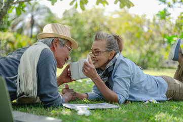 Senior, couples, retirement, insurance, elderly, lifestyle concept..Senior couples  drink coffee on the outdoor lawn in the morning about life insurance plans with a happy retirement.