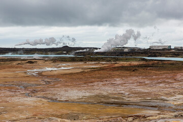 Hot spring plumes over barren land.