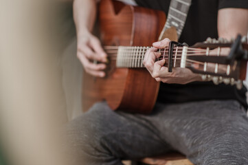 Fototapeta premium The musicians are checking the sound of the guitar and trying to play the guitar before the event starts. Concert,mini concert and music festivals.
