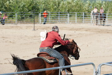 A rider drives his horse during a equestrian competition