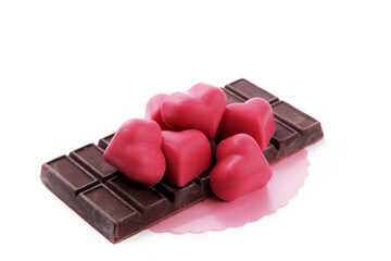 pink valentines chocolates and raw chocolate isolated on white


