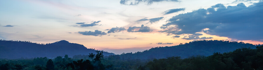 Beautiful panoramas of forests and mountains at sunset.