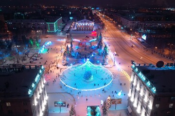 Christmas tree in the central square of the city. View from above.