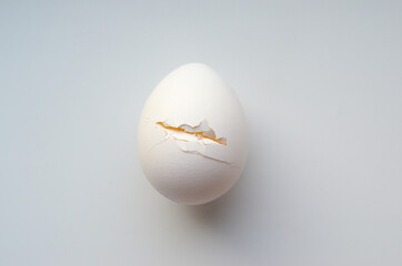 Cracked egg on a white background