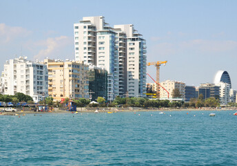 Panorama view of Promenade park on the coast of Limassol city centre on a sunny day with people. The centre of the Cypriot city under construction. July 04. 2018. Limassol, Cyprus
