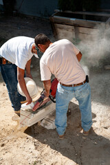 Stone cutting with a gas powered saw
