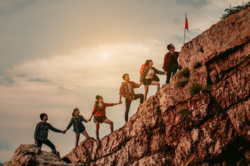 Group of people on peak mountain climbing helping teamwork , travel trekking success business...