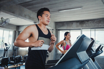 Man running on treadmill in the gym.