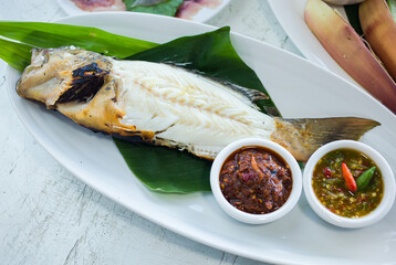 Fresh fish fillet with spicy chili sauce