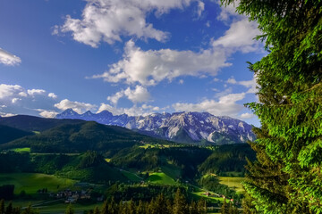 Fototapeta na wymiar high mountain range and green landscape in the summer