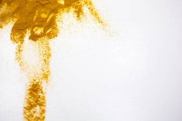Turmeric powder, yellow color. White background