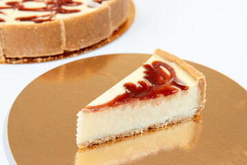 a slice of strawberry cheesecake on white background