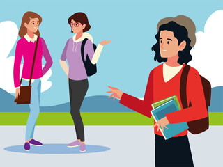 student man and girls talking, holds books outdoors
