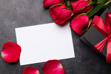 Valentines day greeting card with red rose flowers and gift box