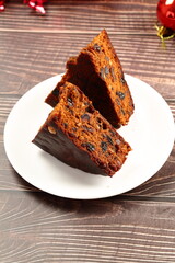 Plate of delicious fresh baked plum fruit cake.