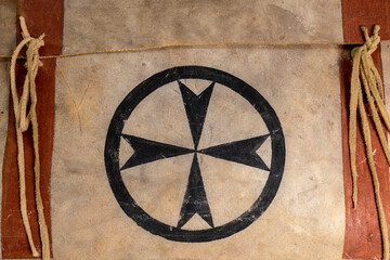 Indian painted rawhide box with leather cords isolated on white