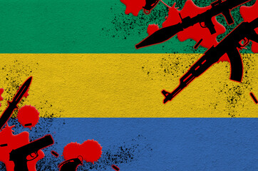 Gabon flag and various weapons in red blood. Concept for terror attack and military operations with...