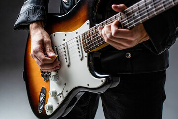 Musical instrument. Electric guitar. Repetition of rock music band. Music festival. Man playing...