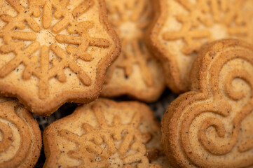 Delicious homemade cookies on a wooden table on a homespun fabric with a rough texture. Close-up selective focus.