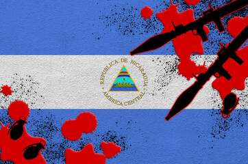 Nicaragua flag and rocket launchers with grenades in blood. Concept for terror attack and military...