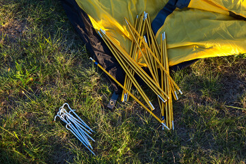 Aluminum mounting arcs, pegs for installation tourist yellow tent and waterproof cloth on ground....