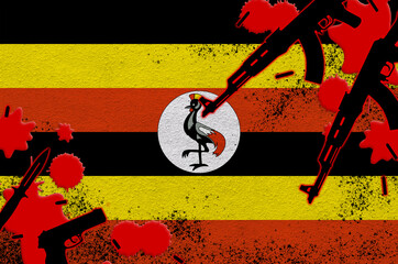 Uganda flag and guns in red blood. Concept for terror attack and military operations
