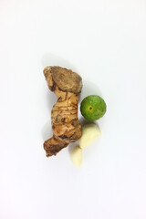 garlic, lime and ginger in white background