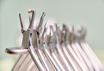Close up view of set of various stainless steel instruments for braces in dental clinic. Concept of...