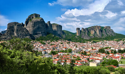 View of Kalampaka and Kastraki villages at foot of Meteora cliffs and pillars on sunny spring day....