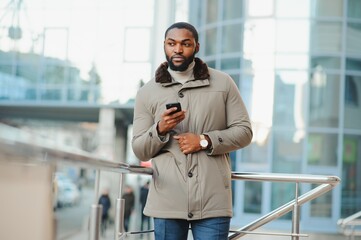 African American man in stylish new clothes on the street