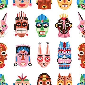 Traditional ritual or ceremonial tribal masks vector flat illustration. Colorful shapes of human face or animal's muzzle seamless pattern. Ethnic decorative masquerade attribute wallpaper template
