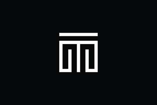 TM logo letter design on luxury background. MT logo monogram initials letter concept. TM icon logo design. MT elegant and Professional letter icon design on black background. M T MT TM