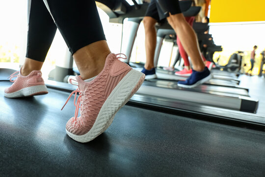 People training on treadmills in gym