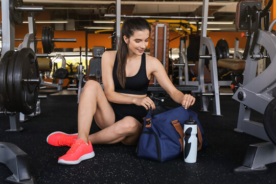 Young Woman With Sport Bag In Gym