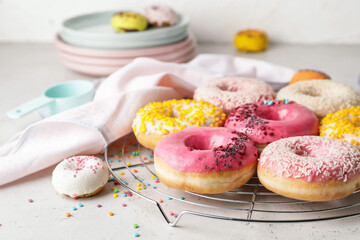 Sweet tasty donuts on table
