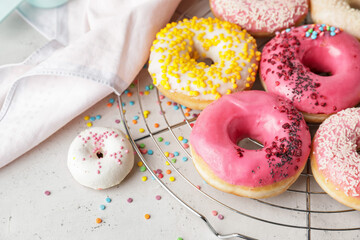 Sweet tasty donuts on table