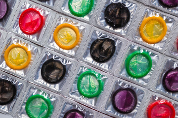 Colorful condoms background.