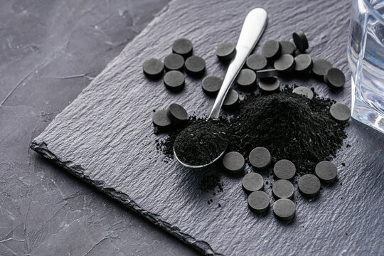 activated carbon on a dark stone background