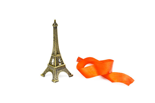 Eiffel tower and red ribbon isolated on white background