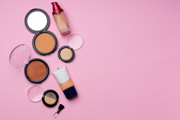 Cosmetics for face complexion on pink background - obrazy, fototapety, plakaty