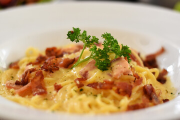 Soft focus Carbonara spaghetti in white plate