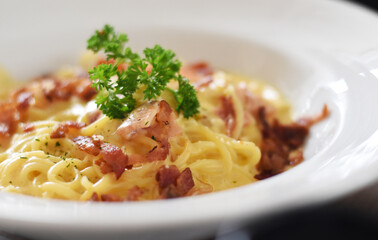 Soft focus Carbonara spaghetti in white plate